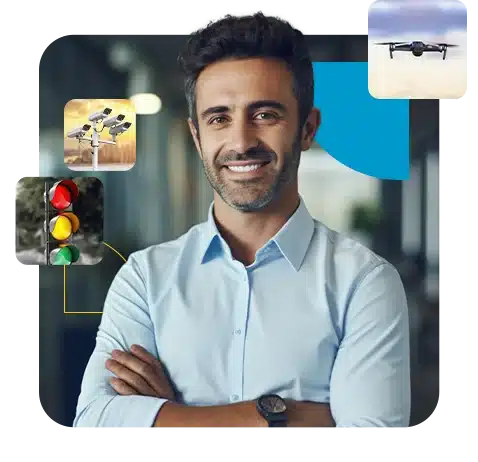 Profissional sorridente em camisa azul com ícones de IoT e M2M ao redor
